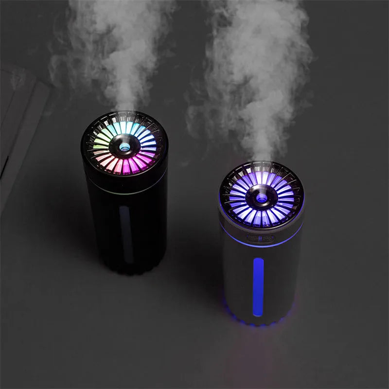 Black USB rechargeable car humidifier with colourful lights showing mist output, sized for cup holders