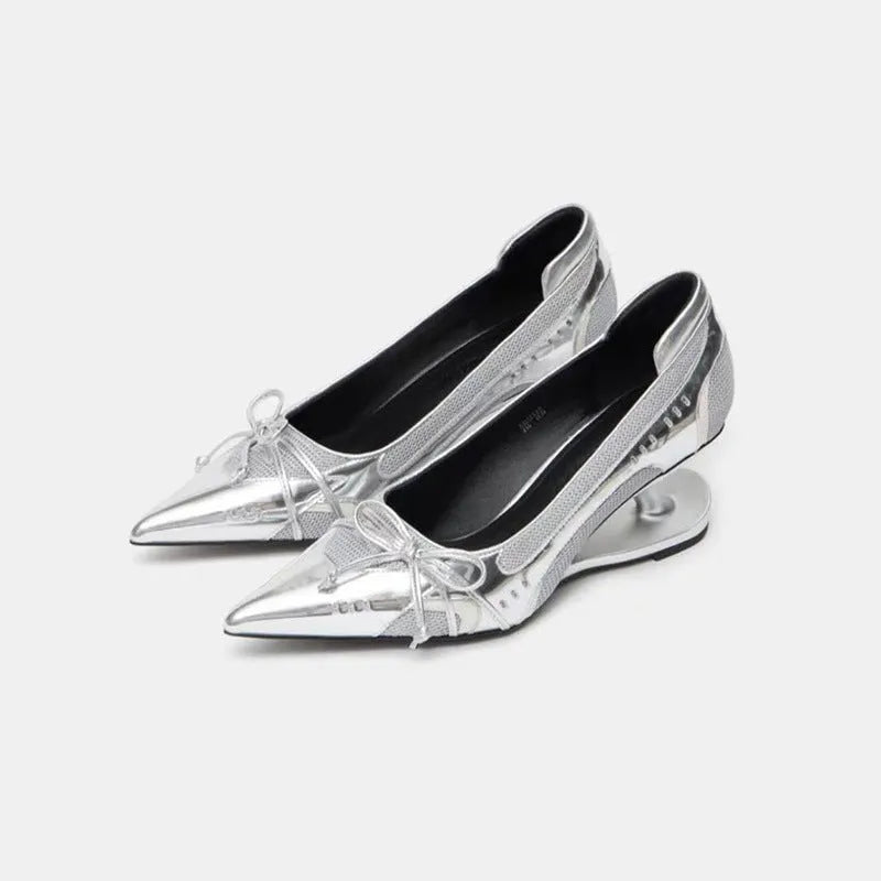 Black women's pointed toe Mary Jane shoes with a unique floating shaped heel and slip-on design.