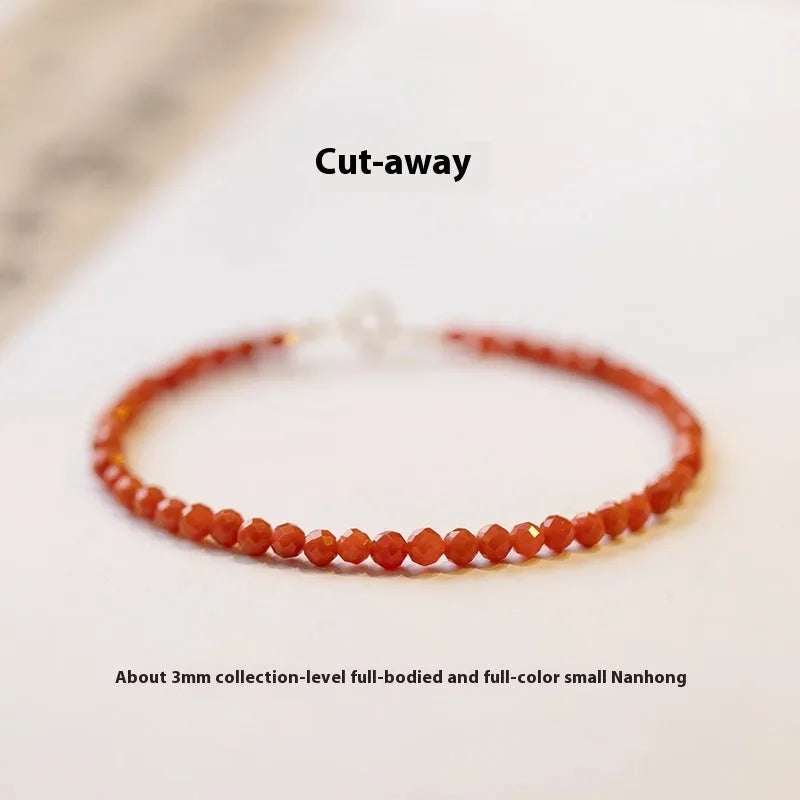 Women's Southern Red agate bracelet with 3mm cut surface in cherry red on a wrist.