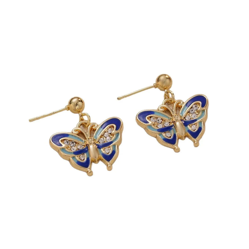 Dripping oil butterfly stud earrings in zinc alloy, classic style, colour O-4-17, on display