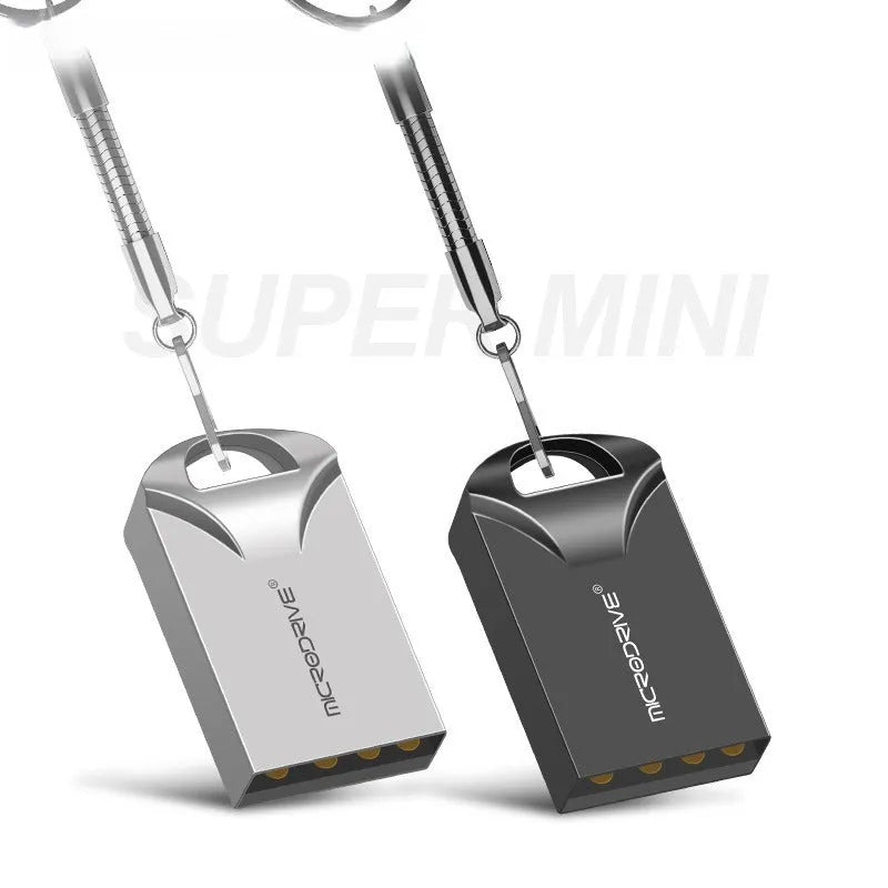 Small silver and black metal USB flash drive on a white background