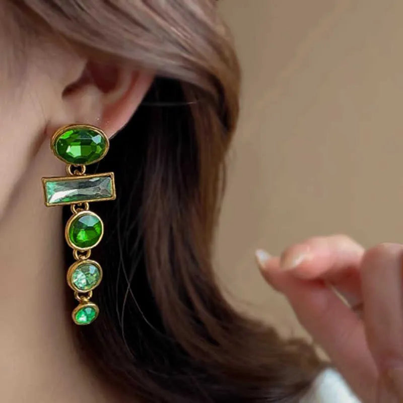Pair of green gradient geometric alloy earrings with inlaid zircon stones and a dangling tassel.