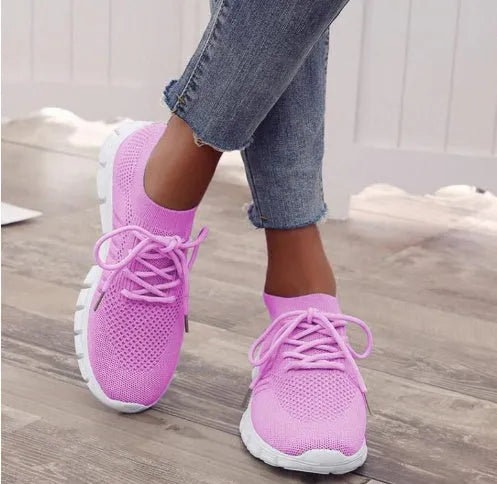 Women's high-cut lace-up casual sneaker in multiple colours on a flat heel with rubber sole
