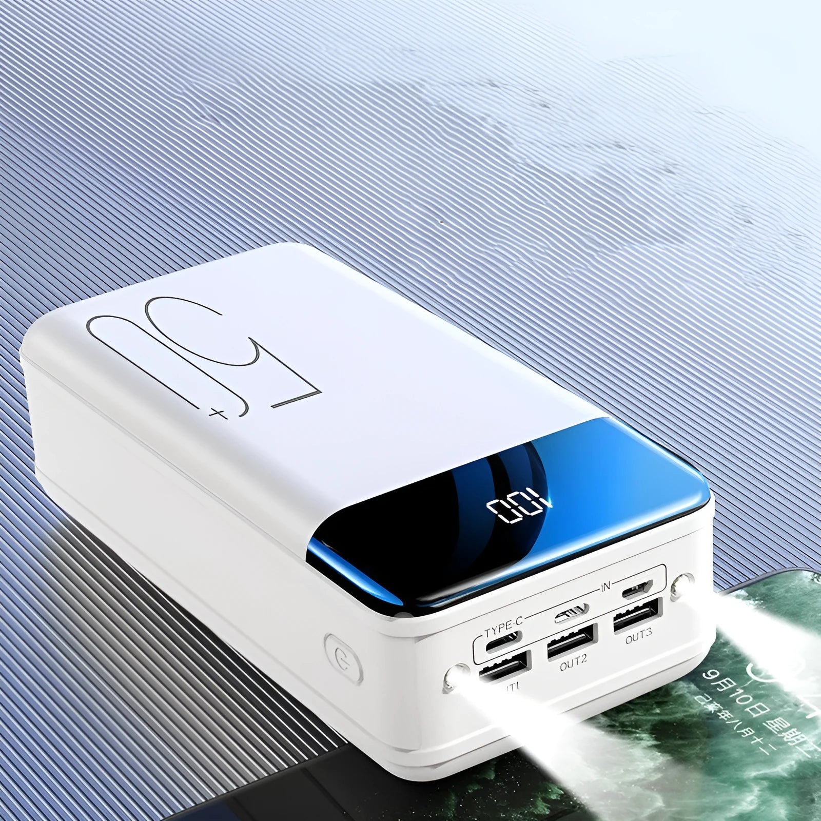 Black and white 50000mAh power bank with three USB output ports, showing dimensions of 169mm x 83mm x 52mm