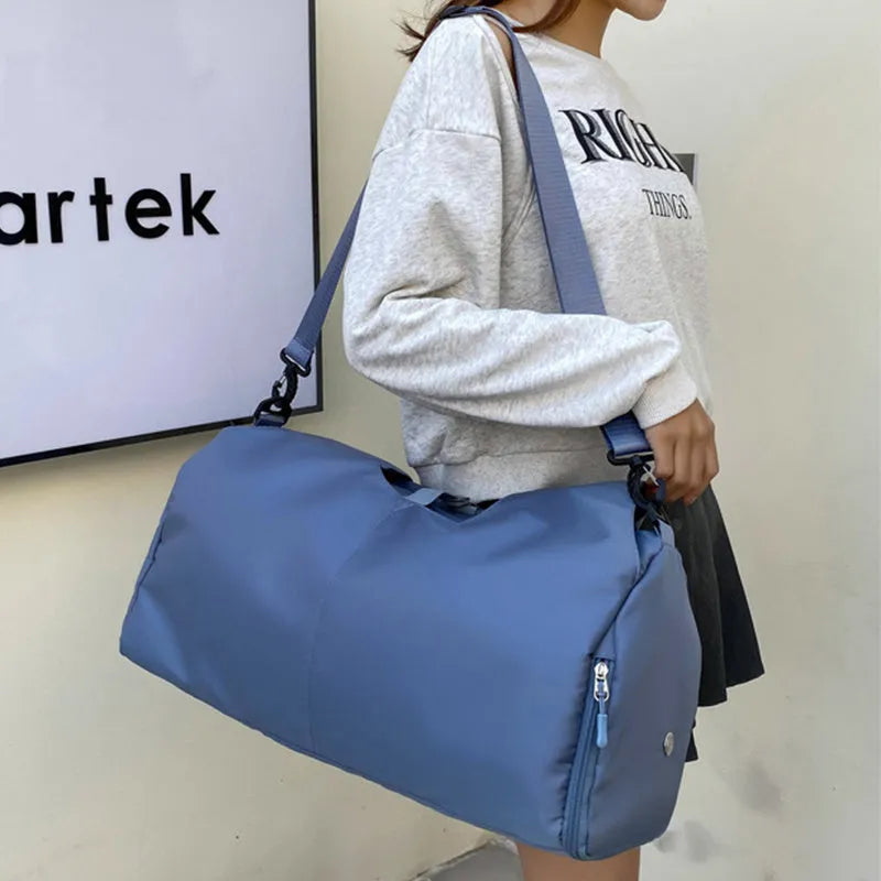Women's large capacity Oxford cloth yoga bag with dry and wet separation in grey, shown with a yoga mat and laptop inside