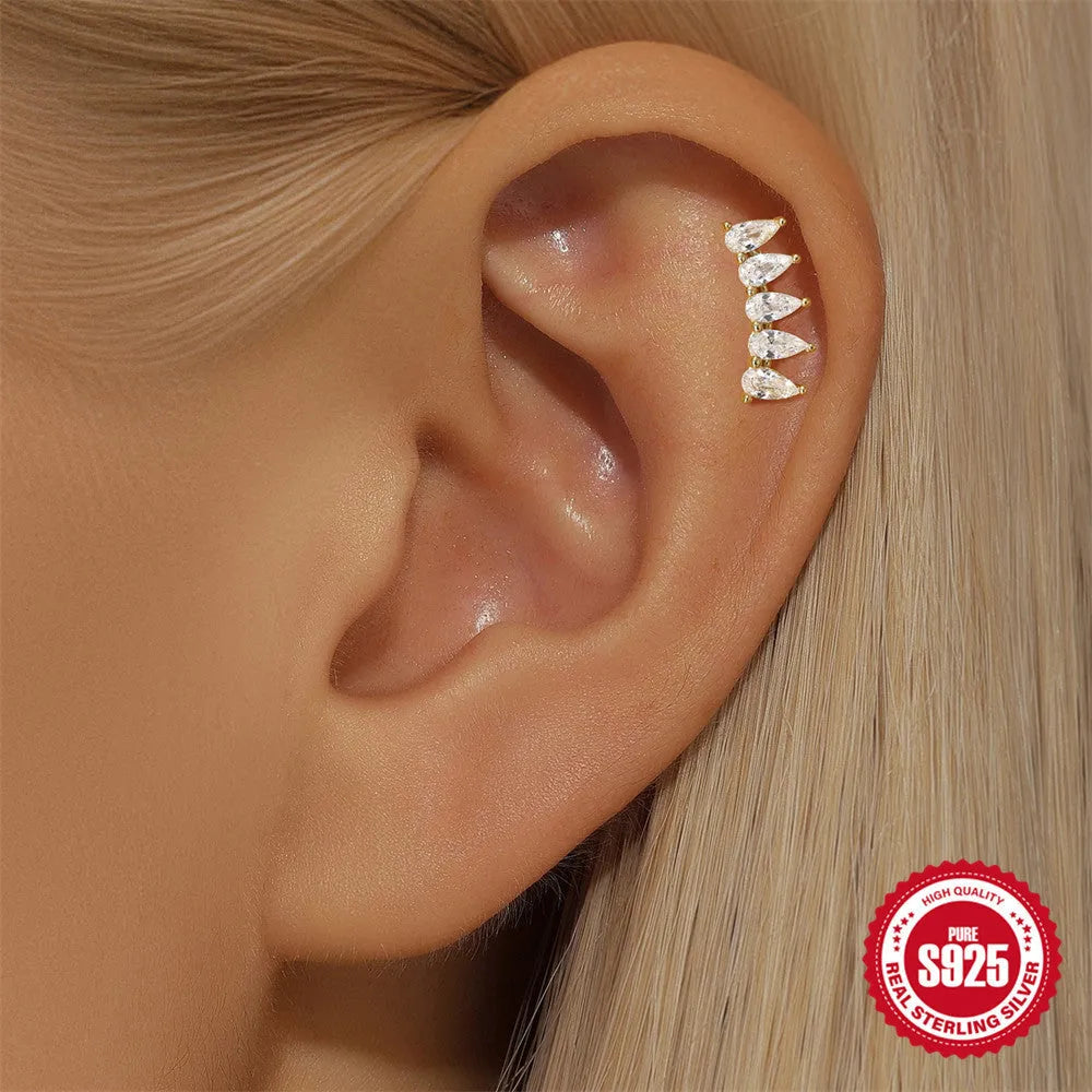 S925 sterling silver moon and star shaped earrings with diamond details on a gold-tone finish.
