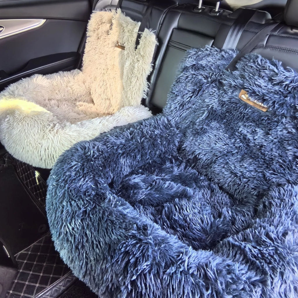 Beige cloth pet car mat shown in a vehicle boot next to a dog.