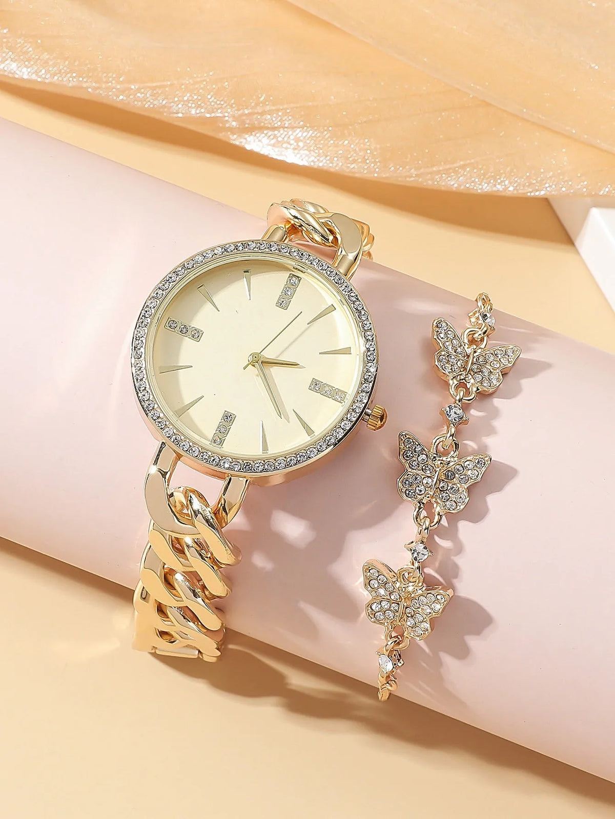 Women's wrist watch with thin alloy strap, circular dial, and titanium metal jewellery buckle