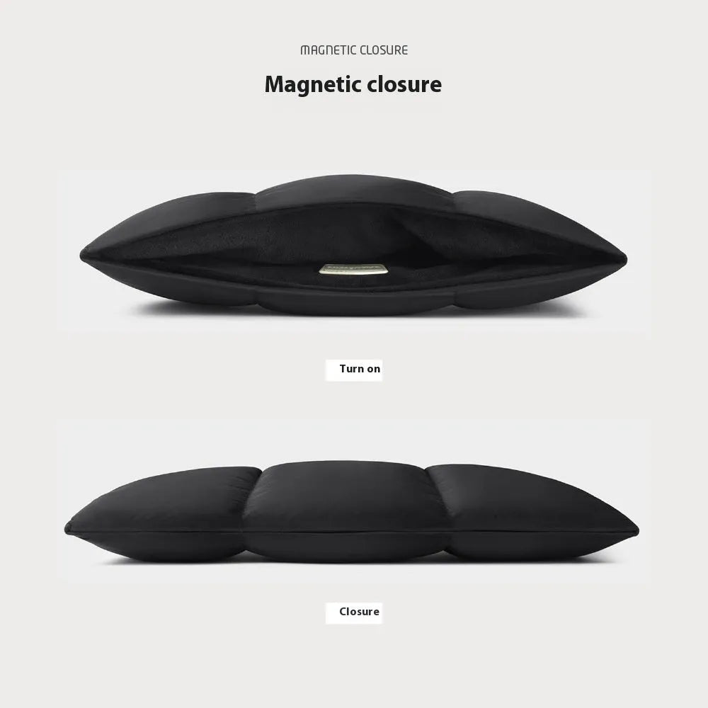 Soft fluffy laptop sleeve in black showing sewing thread details and open to reveal polyester lining