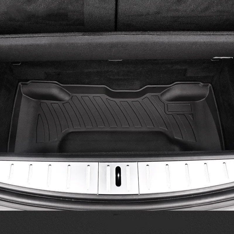 Rubber and TPE floor mat set for a Tesla car interior.
