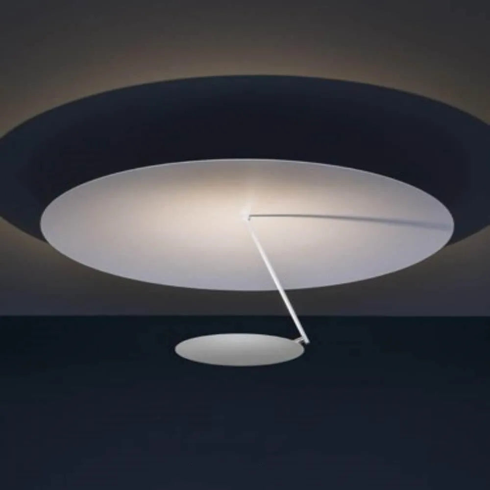 Modern round iron ceiling lamp with a white finish, mounted flush against a ceiling.