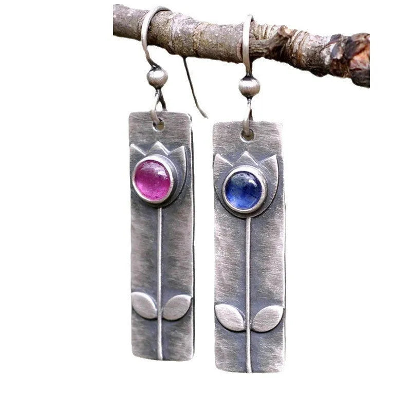Antique finish geometric earrings with oval ellipse design and red sapphire accents