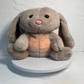 Breathing rabbit plush toy with moving belly and calming features for baby sensory development