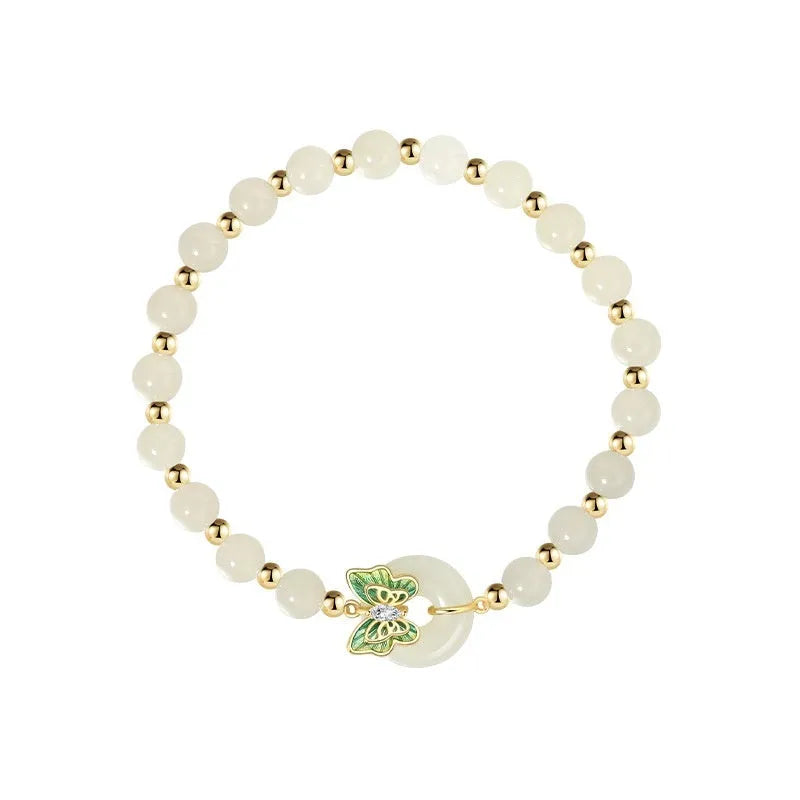 Cyan Hetian Jade bracelet with butterfly design and sterling silver accents, 6mm bead size