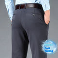 Men's straight-leg suit trousers in black elastic fabric, shown on a hanger.
