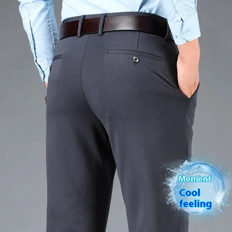 Men's straight-leg suit trousers in black elastic fabric, shown on a hanger.