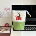 Brown Korean-style cartoon collapsible pencil case made from Oxford cloth, shown open and closed.