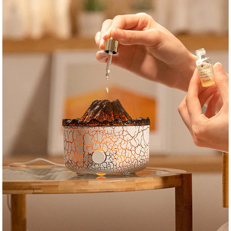 Volcano-shaped humidifier with LED flame effect emitting mist rings for atmospheric room enhancement