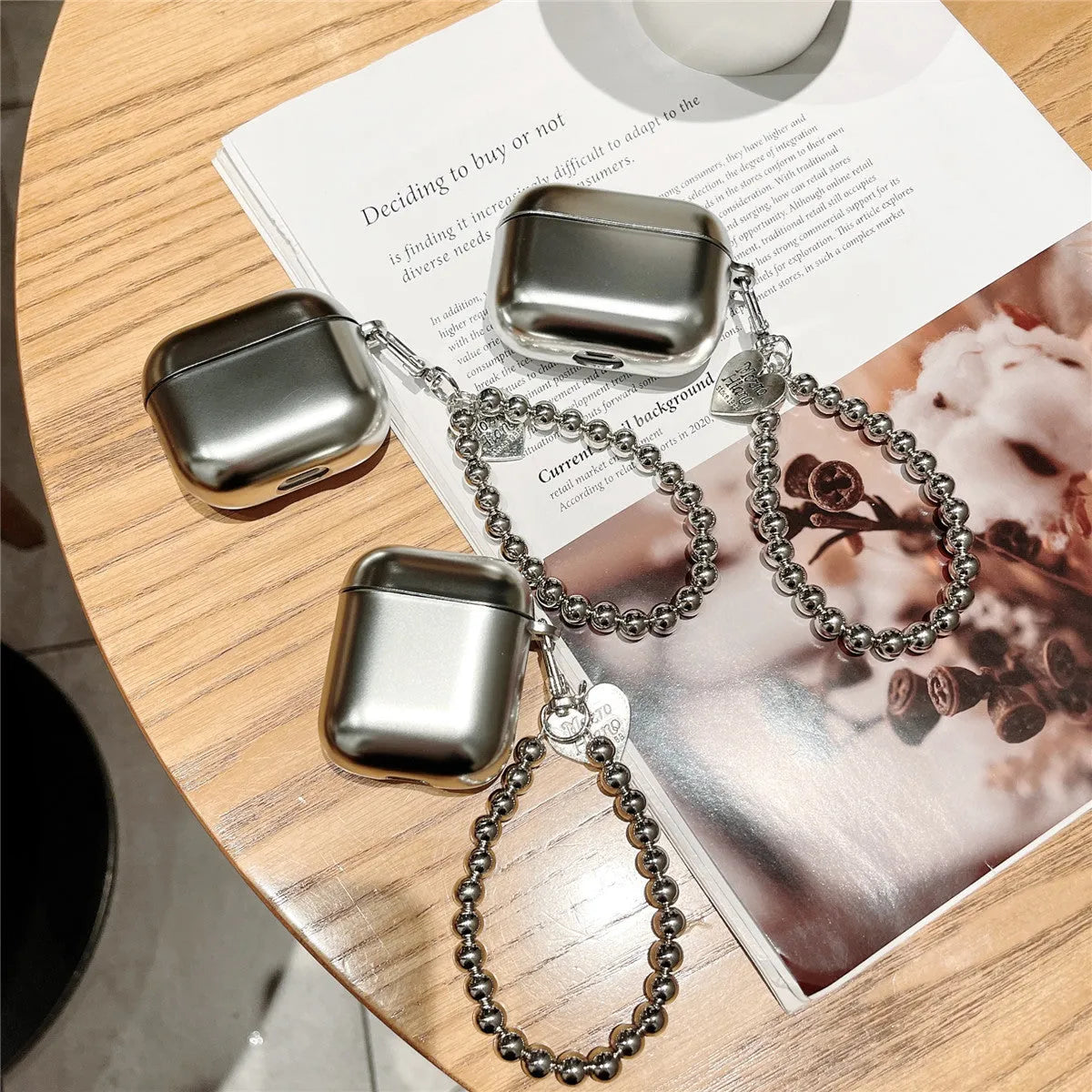 Matte plating TPU protective case for AirPods with an attached bracelet strap.