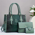 Women's minimalist textured PU leather three-piece bag set in burgundy, showing crossbody bag, wallet, and cardholder.