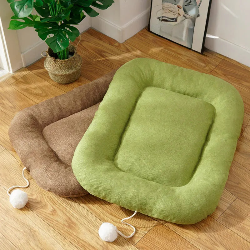 Kennel cooling cushion with removable cover in brown, shown next to S, M, L, XL size indicators