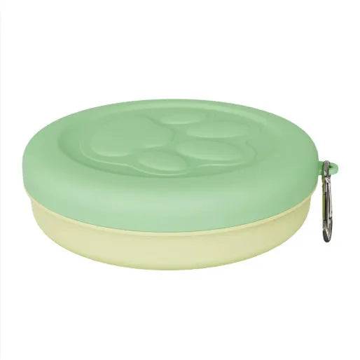 Collapsible silicone dog bowl in green, shown both open for use and folded flat for storage.