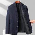 Men's loose-fit woolen suit coat in a solid colour, shown for casual spring or autumn wear.