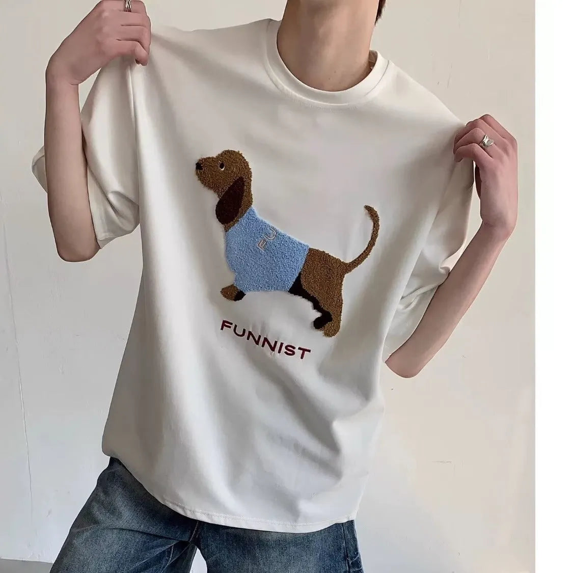 Men's grey cotton T-shirt with a black embroidered sausage dog design on the chest.