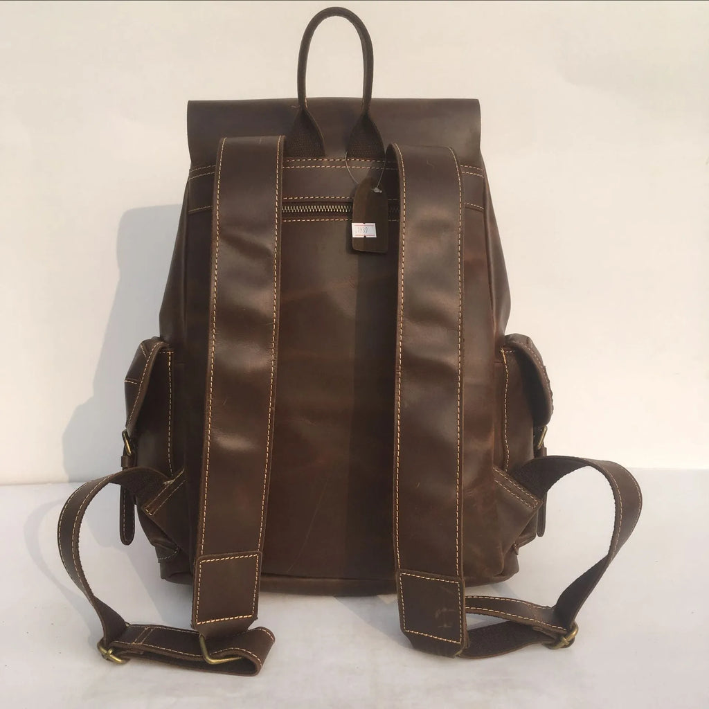 Brown men's leather backpack made from top-layer cowhide with an air pillow belt back system.