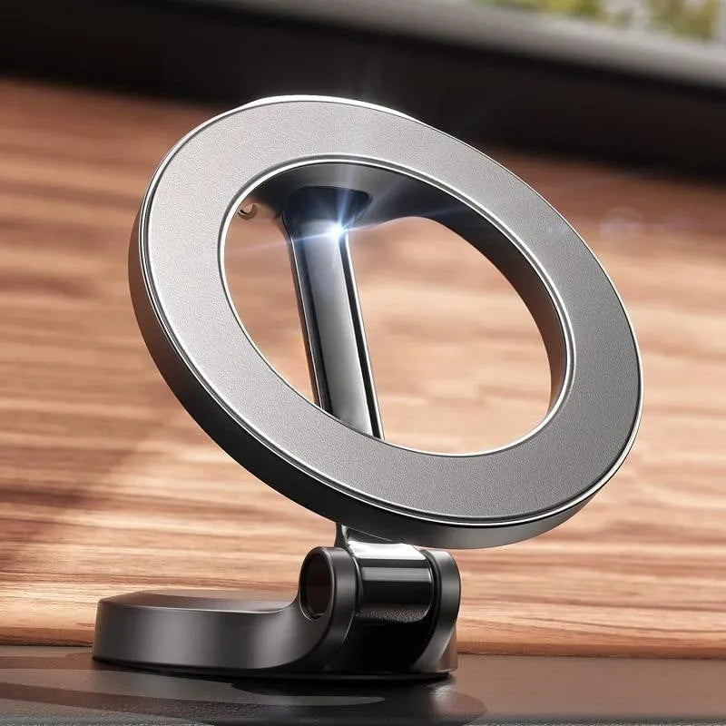 All-metal foldable magnetic car phone mount shown on a dashboard, holding a mobile phone.