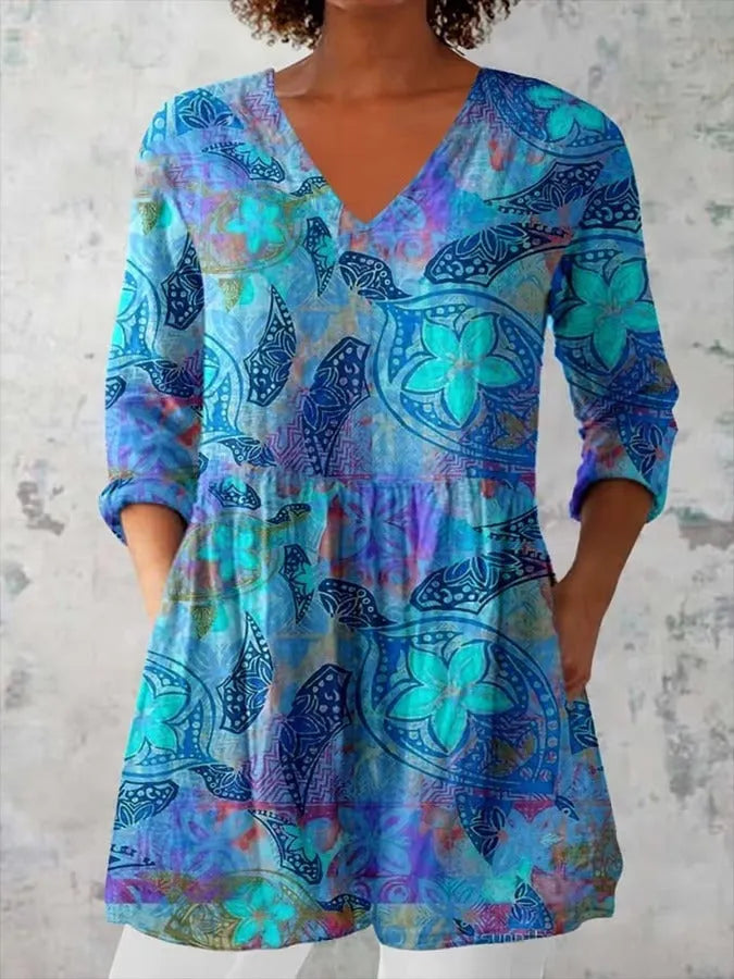Women's retro-style slim-fit long-sleeved top with a colourful digital print pattern, shown on a model.