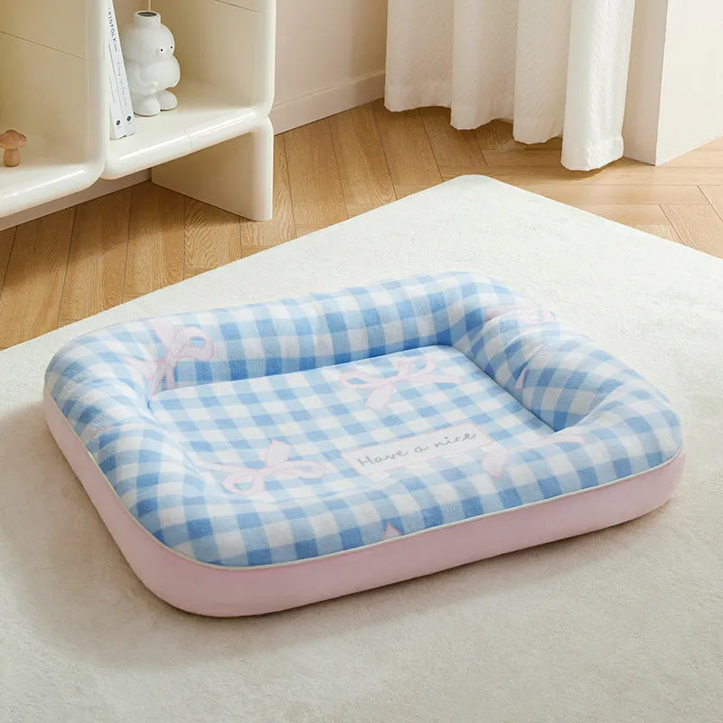 Blue small dog bed cushion with PP cotton fill, size M, on a sofa