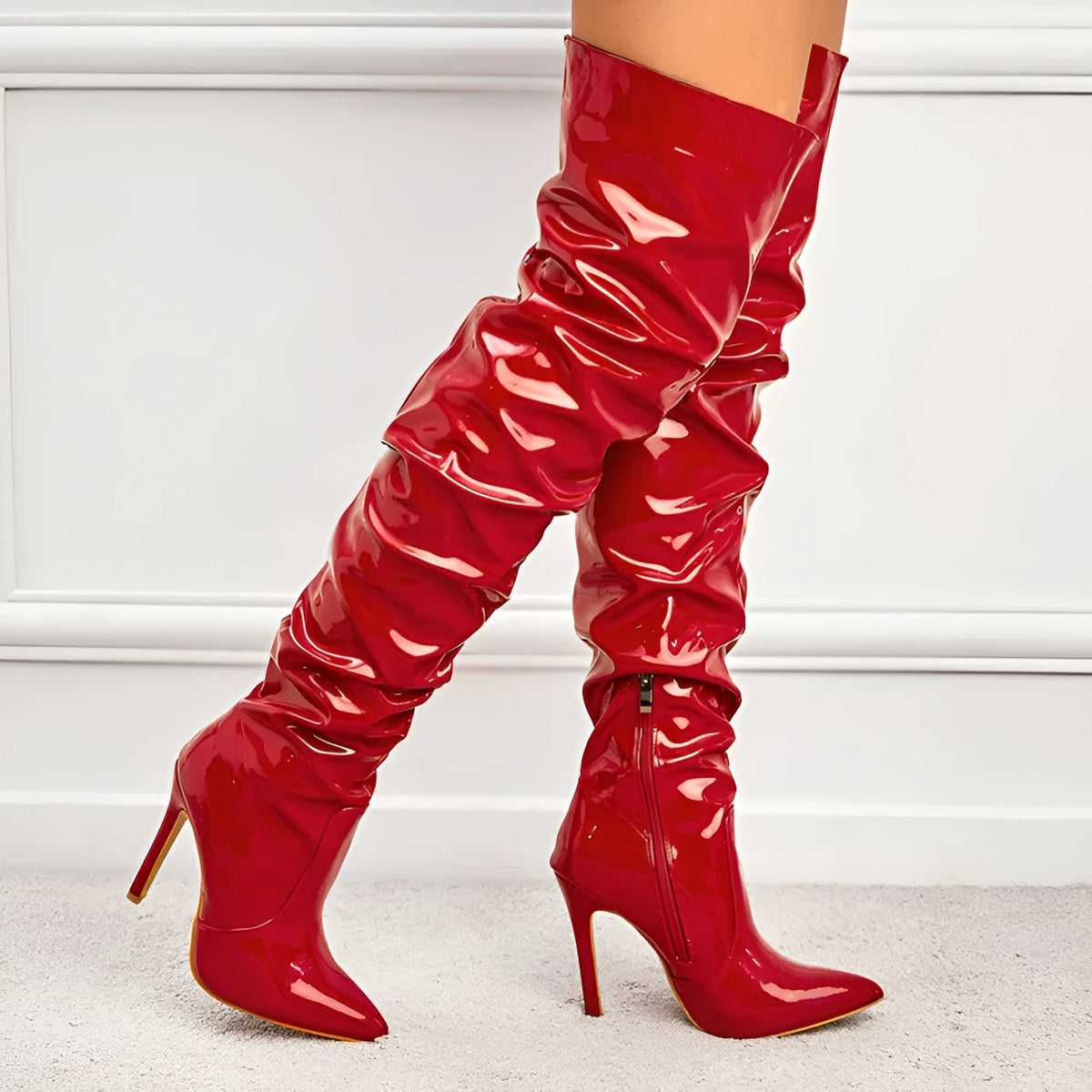 Women's knee high super high heel boots with side zipper, pointy toe, and leather stitching detail in solid colour