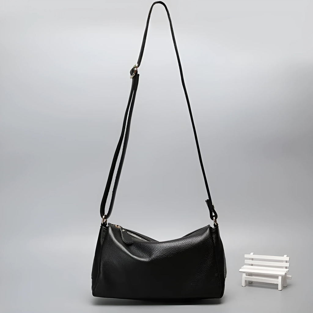 Soft genuine leather women's crossbody bag in horizontal square shape with an outer pocket.