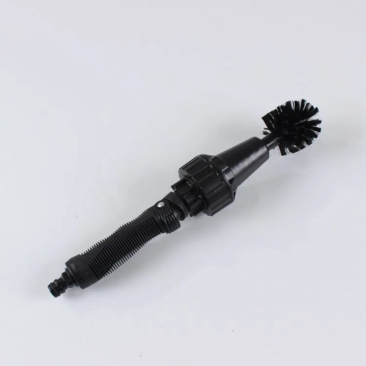 Black water-powered wheel brush 38cm long with soft and rigid brush heads connected to garden hose for tyre cleaning