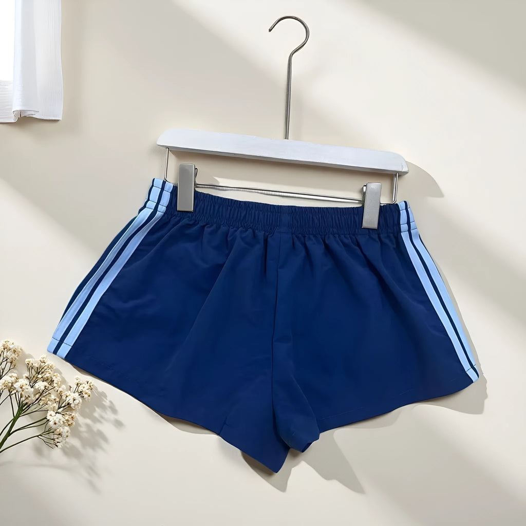 Men's navy blue high waist nylon sports shorts with micro elasticity on a white background