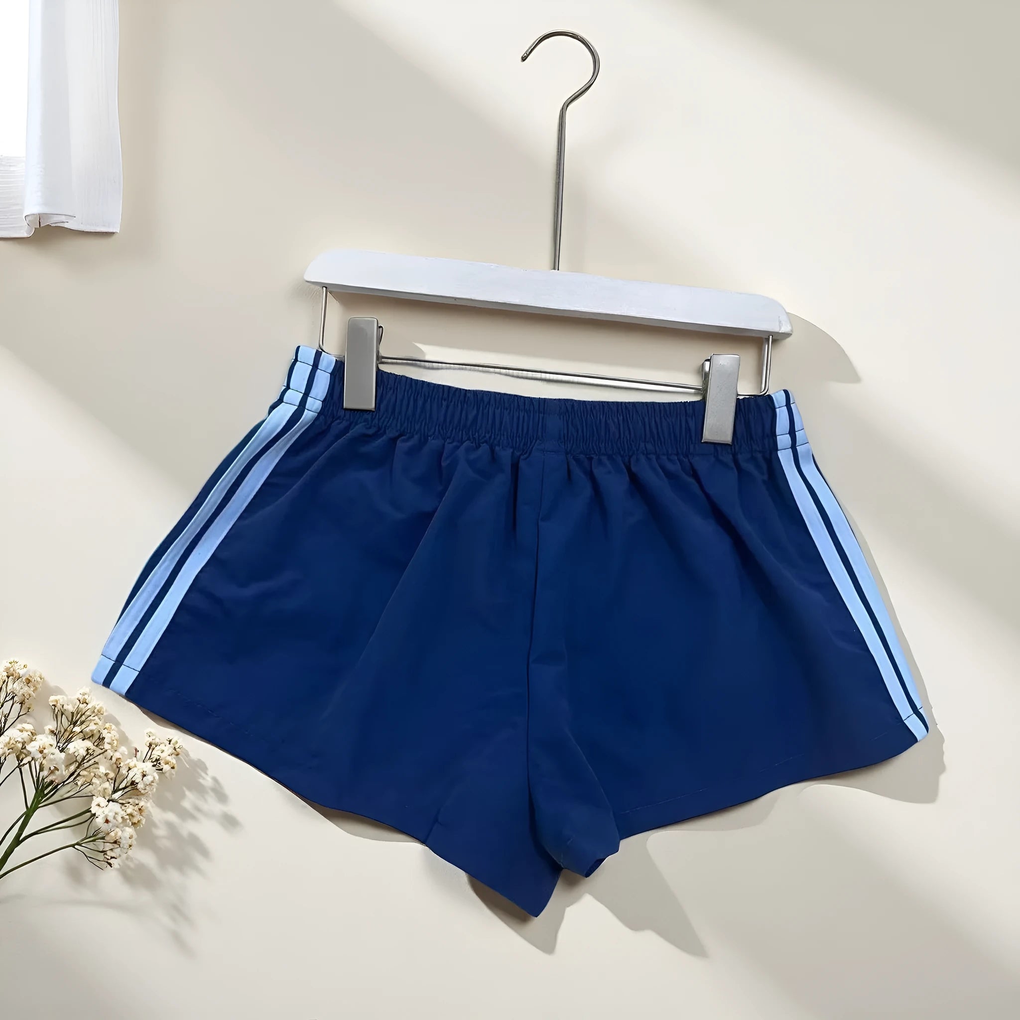 Men's navy blue high waist nylon sports shorts with micro elasticity on a white background
