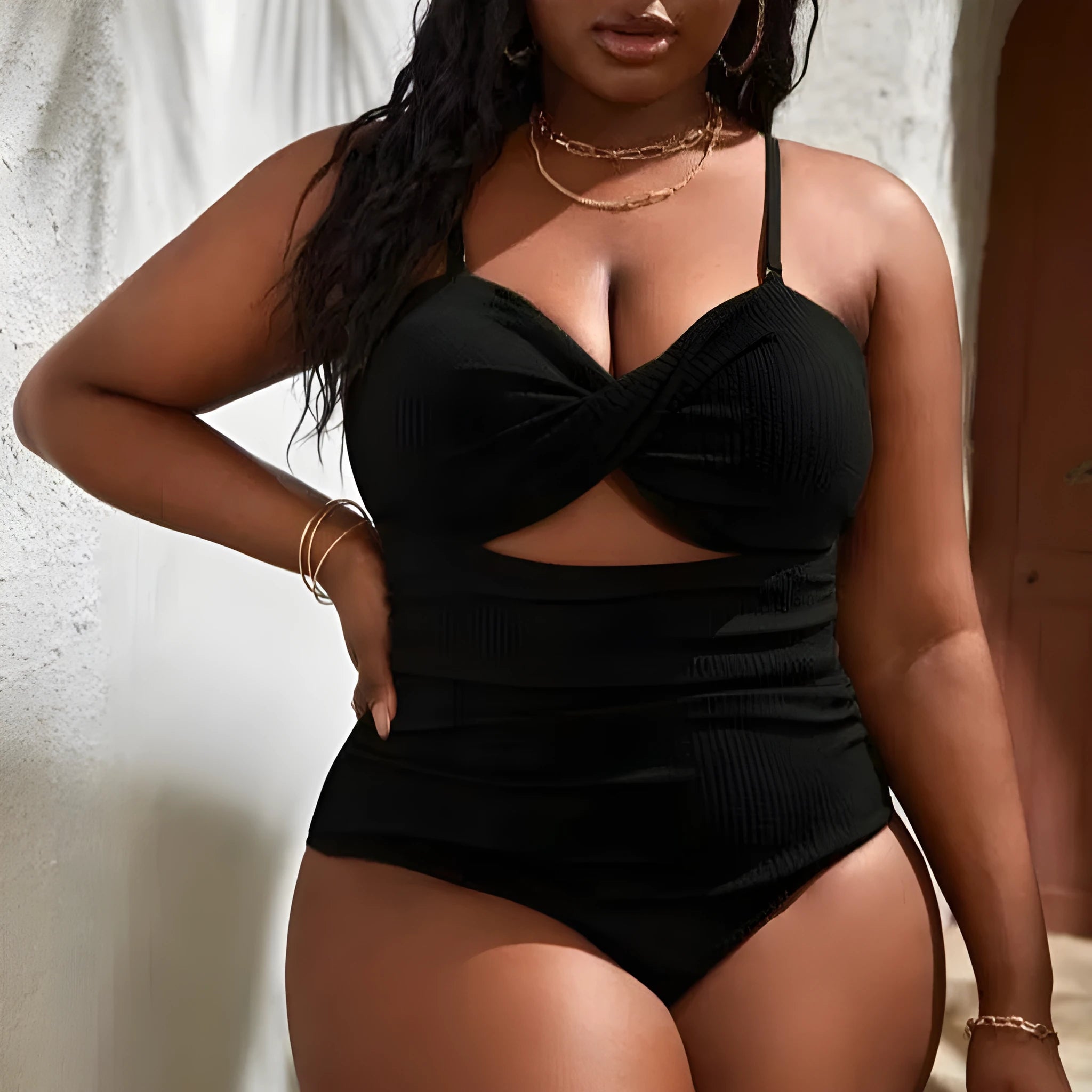 Black plus size women's slimming one-piece swimsuit with sleeveless triangle style design