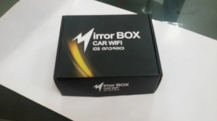Black car mirror link box Wi-Fi converter with AV cable, power cable, and antenna for smartphone screen mirroring.