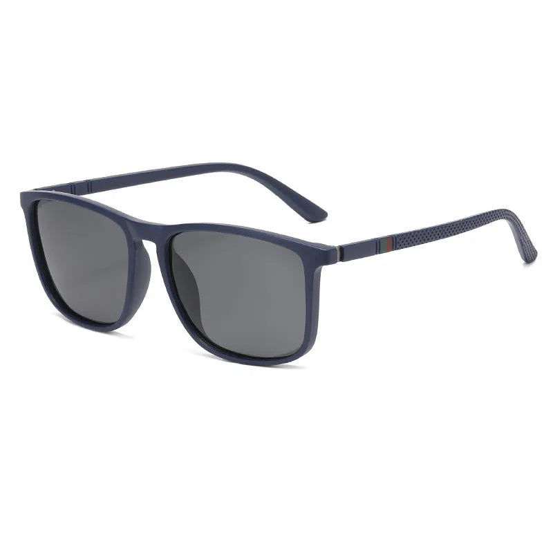 Sports driving polarized sunglasses with black frame and black grey TAC lens on reflective surface