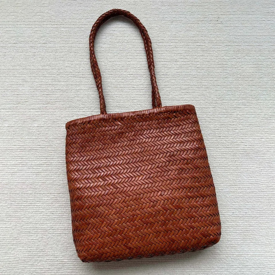 Brown handmade woven tote bag made of genuine cowhide leather with a three-dimensional pocket.