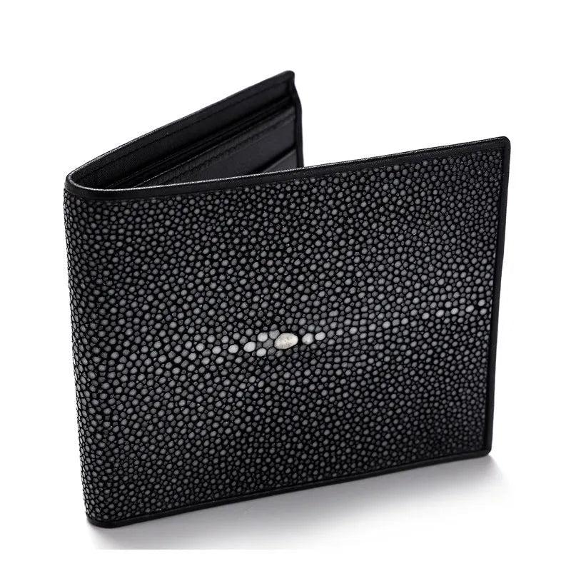 Genuine leather pearl fishskin wallet in horizontal square shape on a plain background
