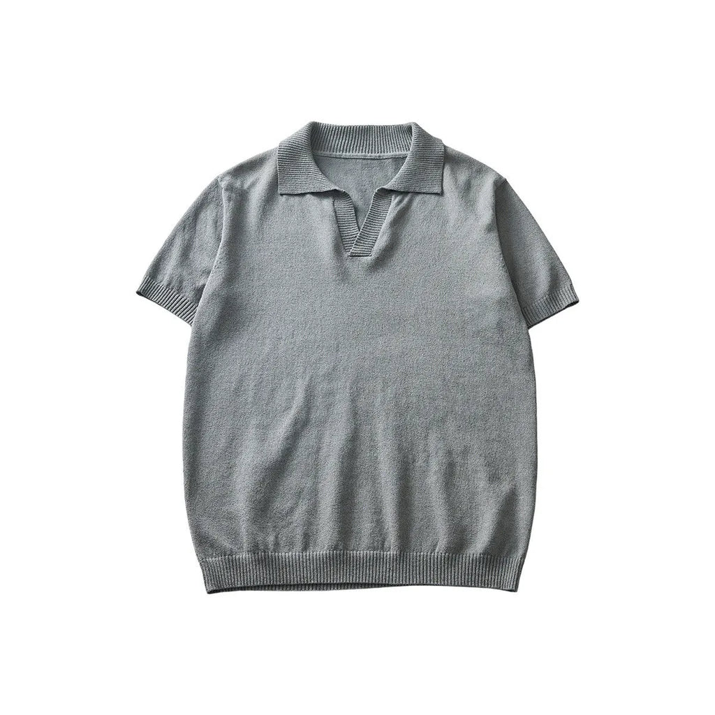 Men's solid colour knitted polo shirt with short sleeves and a collar on a hanger
