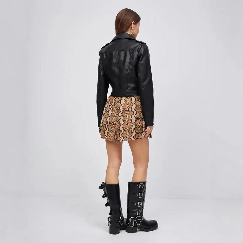 Black women's retro style PU leather coat with regular sleeves on a street fashion background