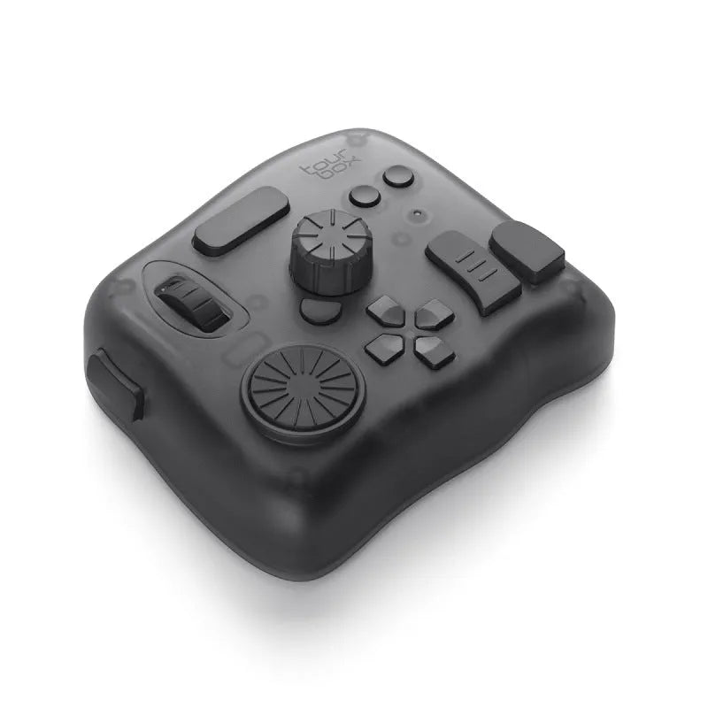 TourBox NEO black auxiliary keyboard controller for video editing on a desk.
