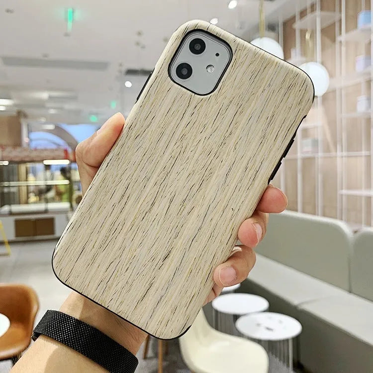 A natural wooden mobile phone case for iPhone, shown in rosewood colour on a table.