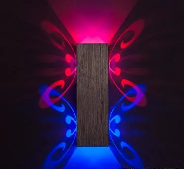 Butterfly-shaped aluminium wall lamp with multi-colour LED lighting options.