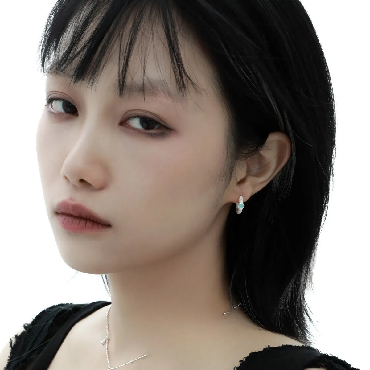 Female geometry round ear clip in burnt silver finish made from 925 silver