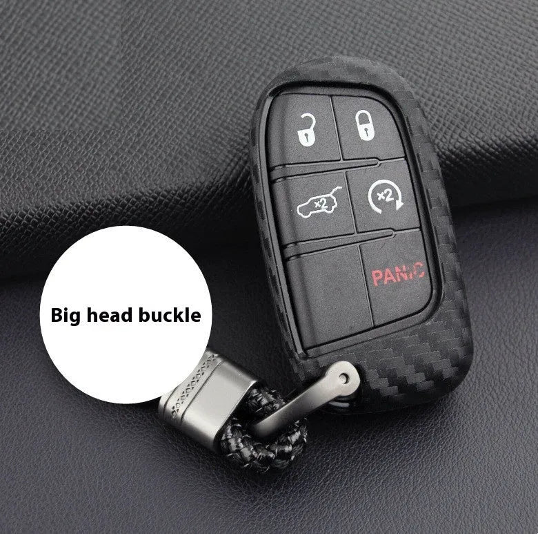 Carbon fibre pattern silicone protective case for a Dodge, Chrysler, or Fiat car key remote with a large head buckle.