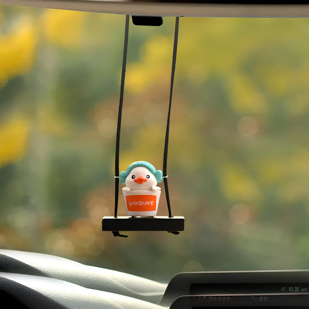 Yellow cartoon duck car hanging ornament in plastic, shown in four style variations.